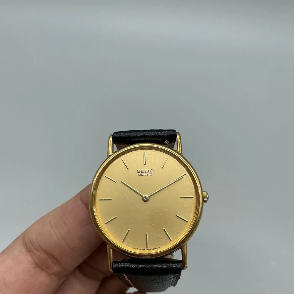 Vintage Seiko Mens Watch 31mm Gold Tone Black Leather 7N00-7A49 New Battery